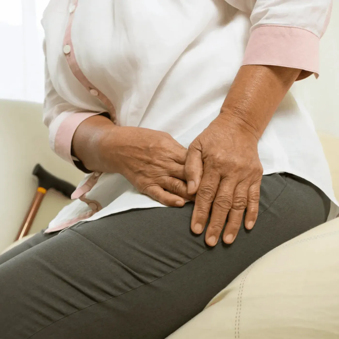 Woman with osteoporosis experiencing hip pain.