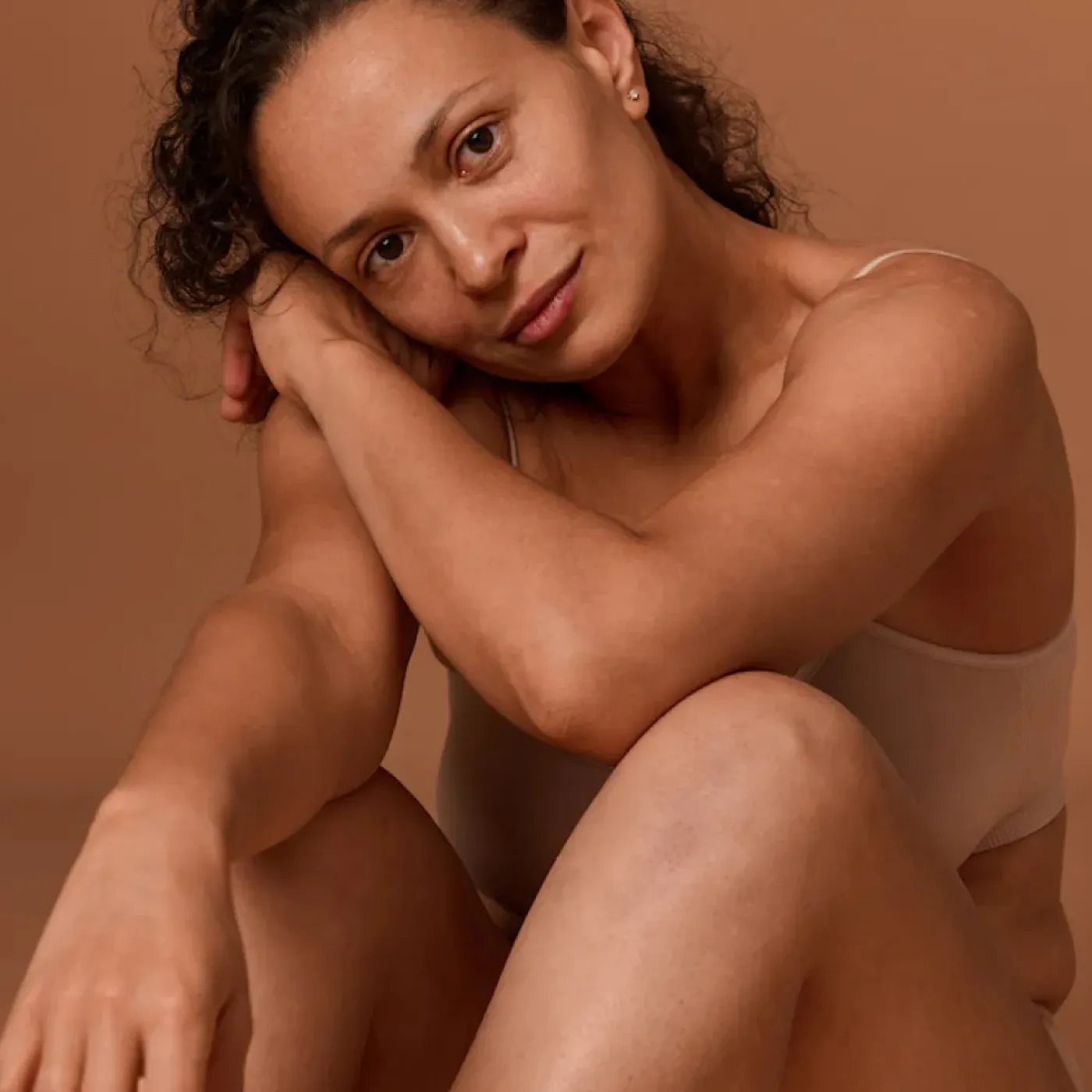 A post-menopausal woman feeling good in her body after receiving pelvic floor physical therapy for pain with sex and weak orgasm.