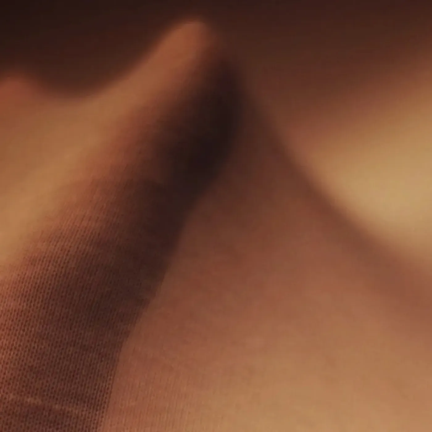 An image of a hand stretching nylon to symbolize the anatomy of fascia.