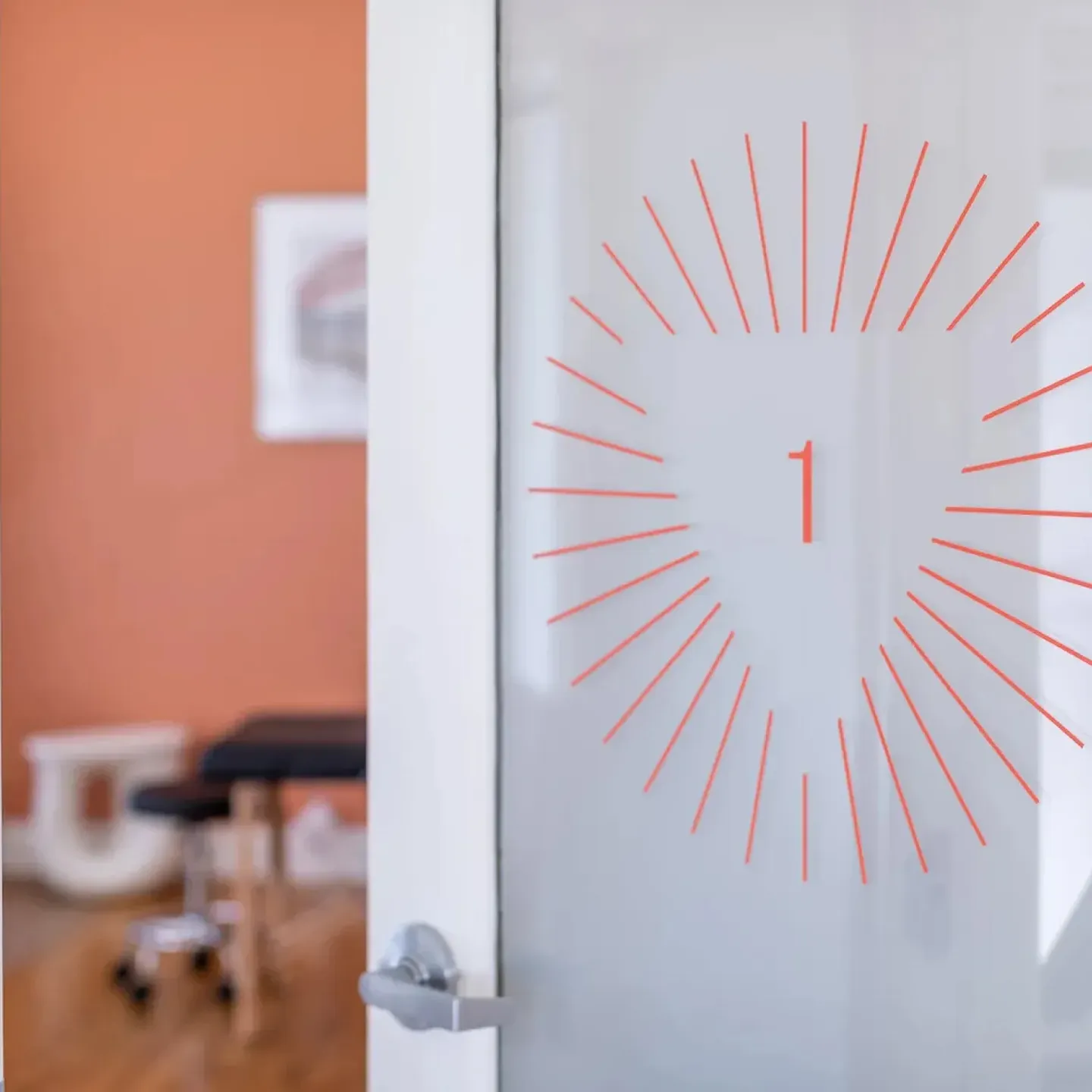 A door leading into a spa-like treatment room at Origin Physical Therapy in San Diego, CA.