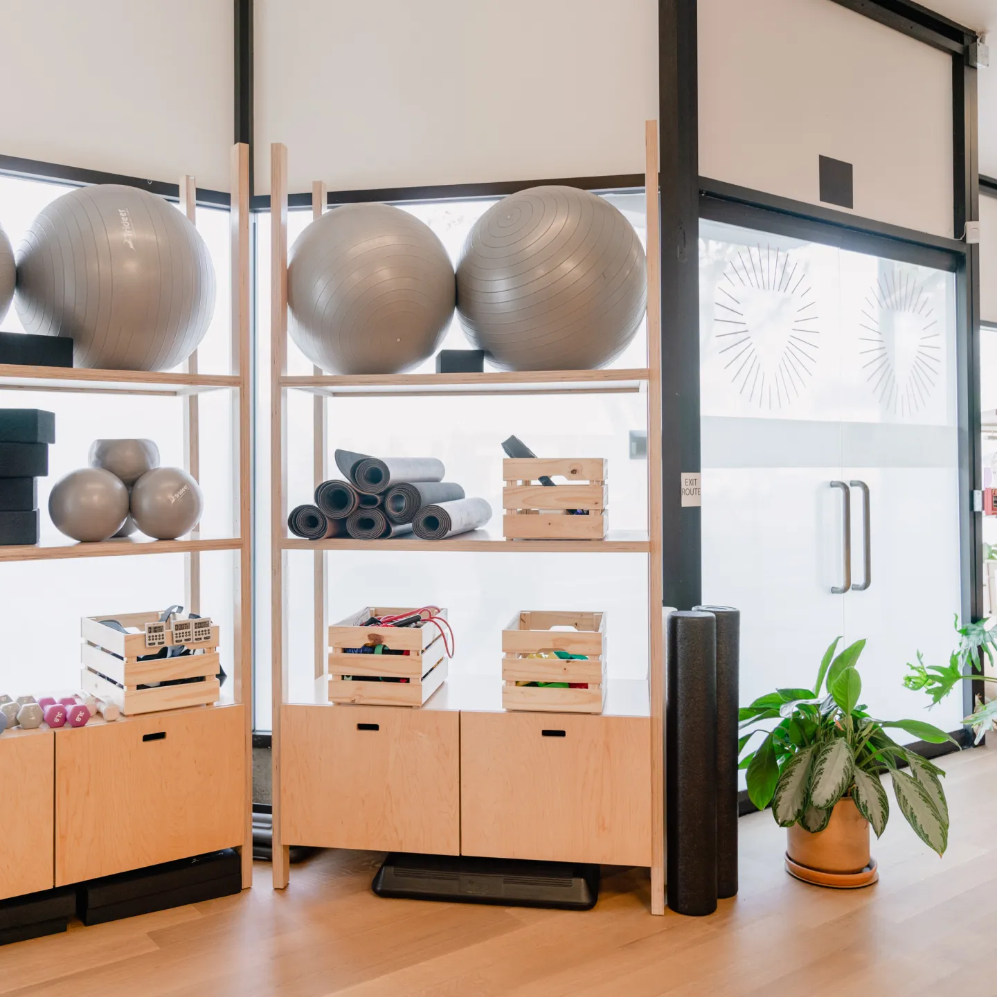 Bright, colorful gear and cheerful plants at Origin’s Brentwood clinic.