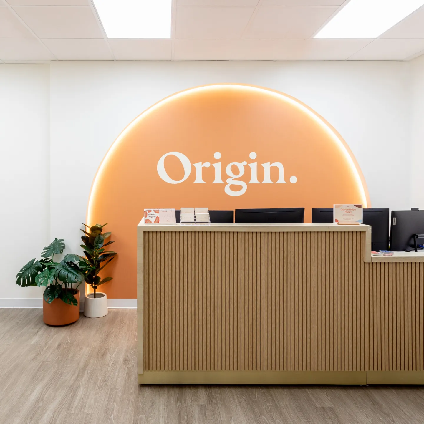 The cheerful and spa-like front desk at Origin’s West Loop clinic.