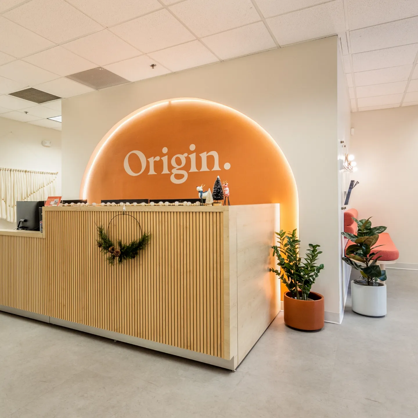 One of the brightly lit, cheerful front desks at Origin.