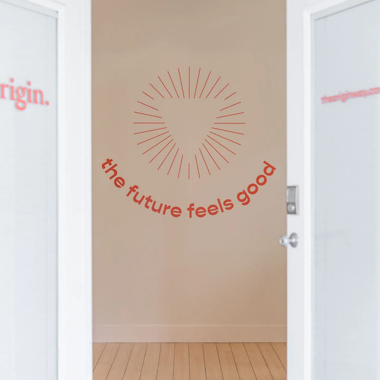 Uplifting wall art featuring the words “the future feels good” at Miami clinic.