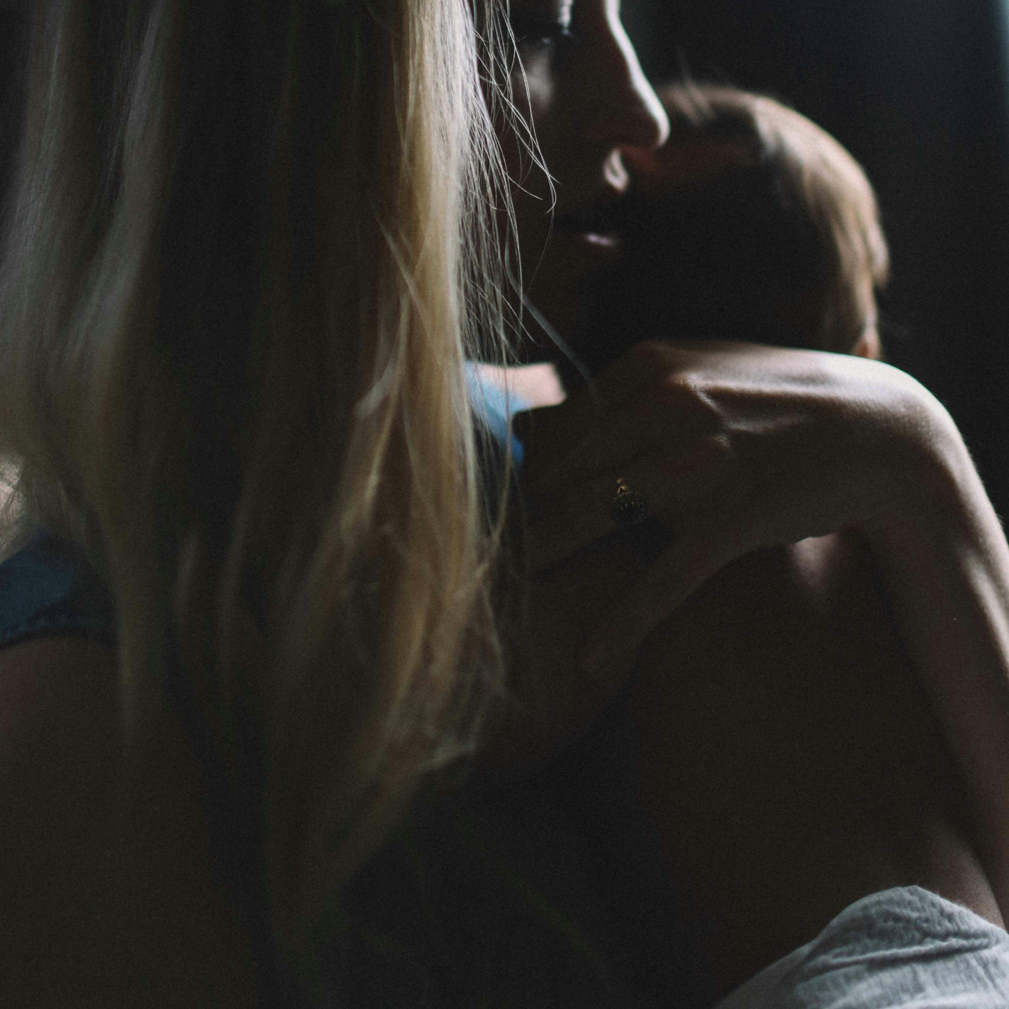 Postpartum woman with newborn representing postpartum hormone changes and mental health in the fourth trimester