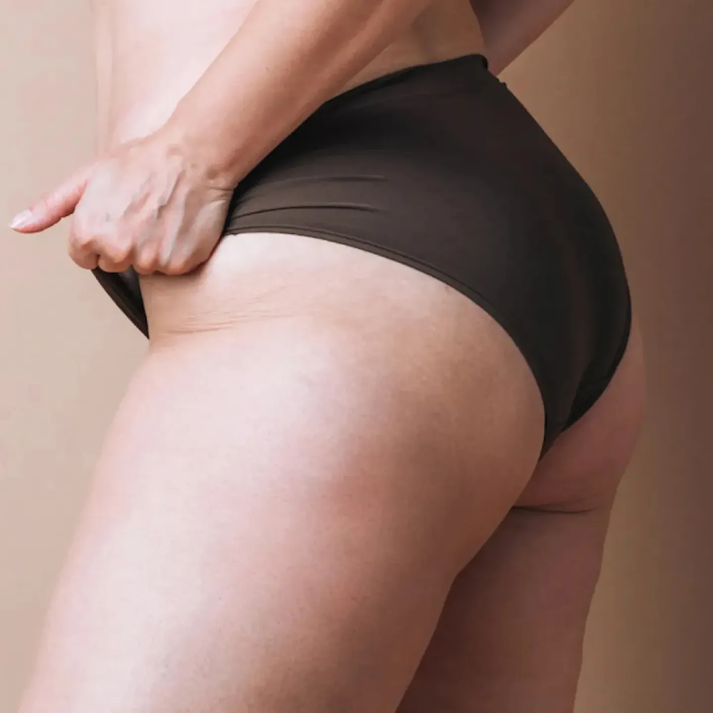 A woman holding on confidently to her underwear for a story on using vaginal dilators for vaginismus.
