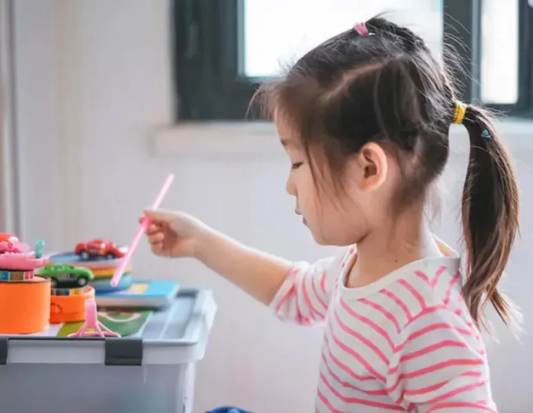 Little Girl Playing.