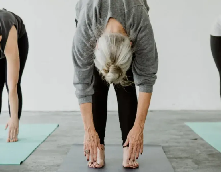 Mature woman stretching.