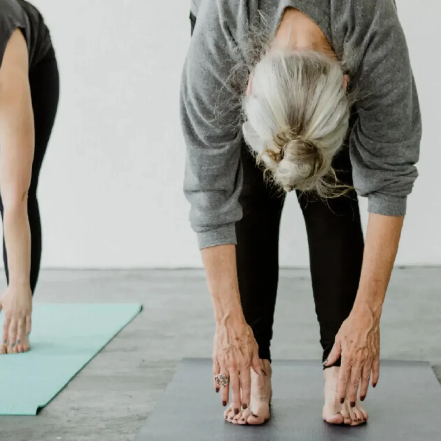 Mature woman stretching.