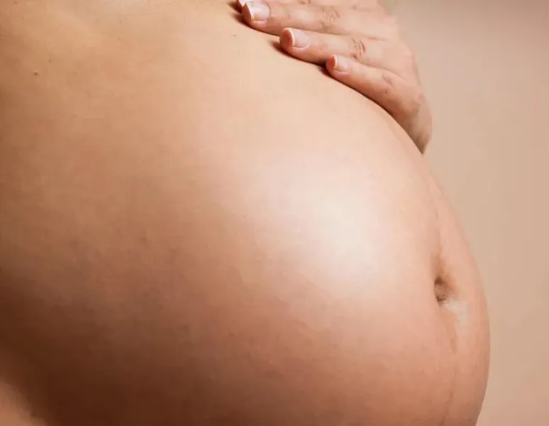 Mother's pregnant belly.