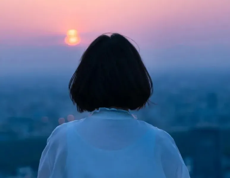 Woman looking into distance.