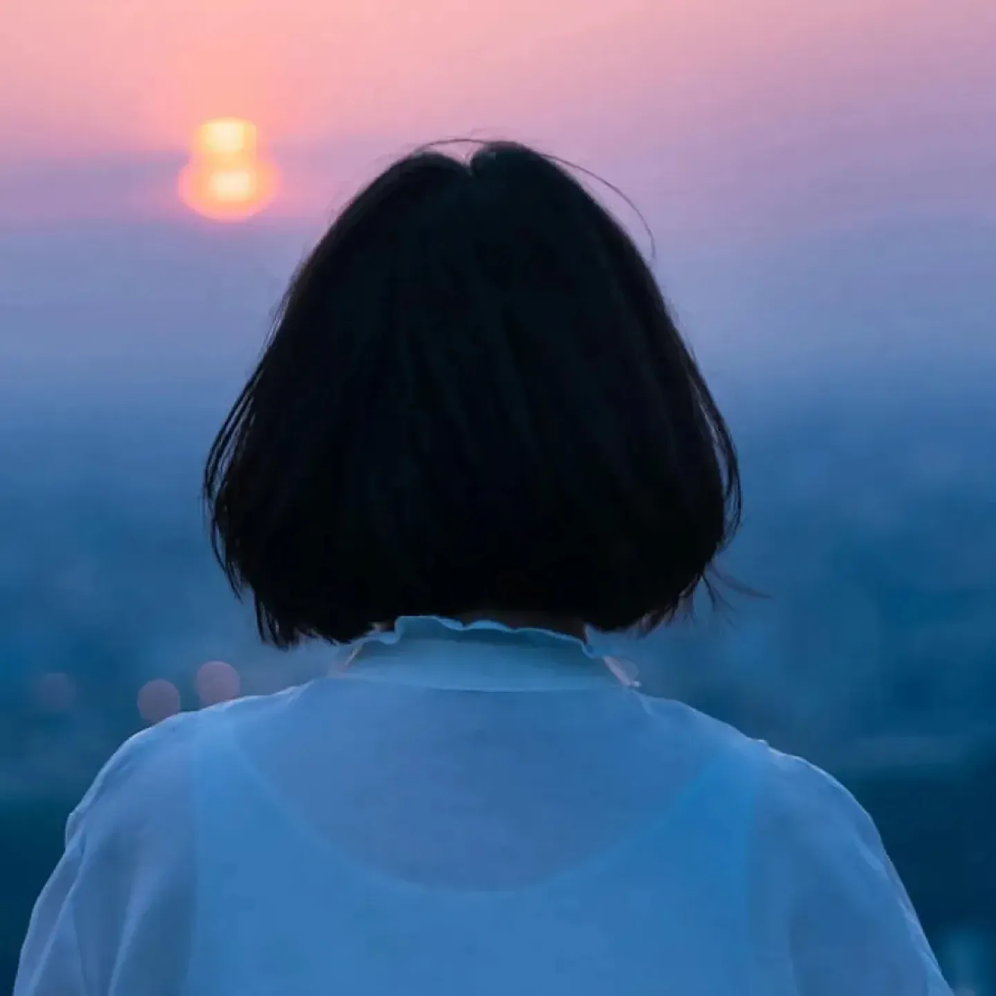 Woman looking into distance.