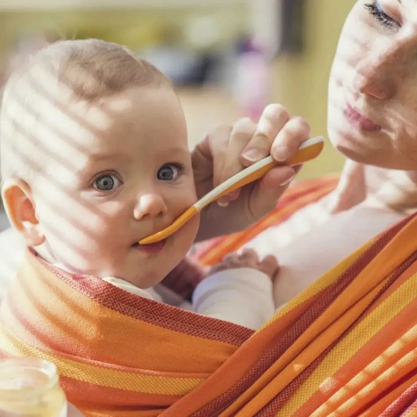 Mother with baby in baby carrier.