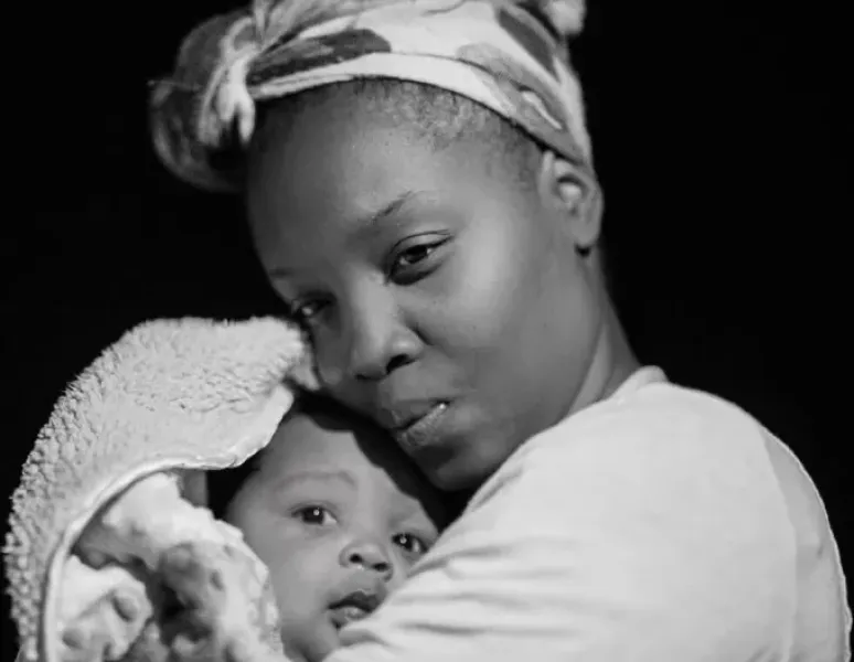 Black mother with baby.