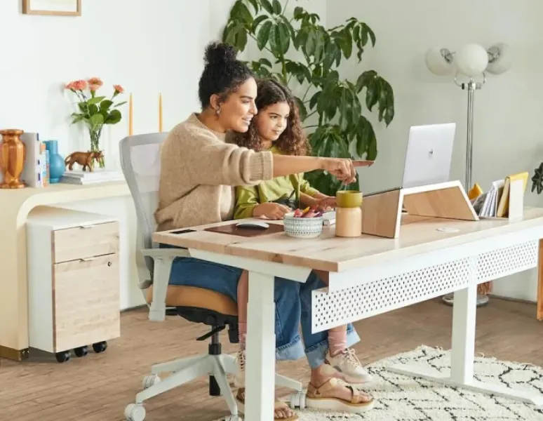 Mother and daughter with computer.