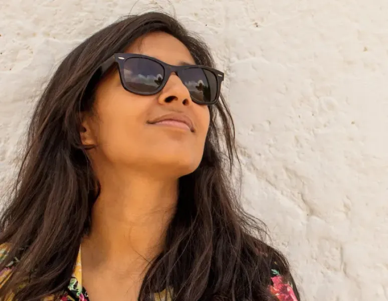 A woman wearing sunglasses.