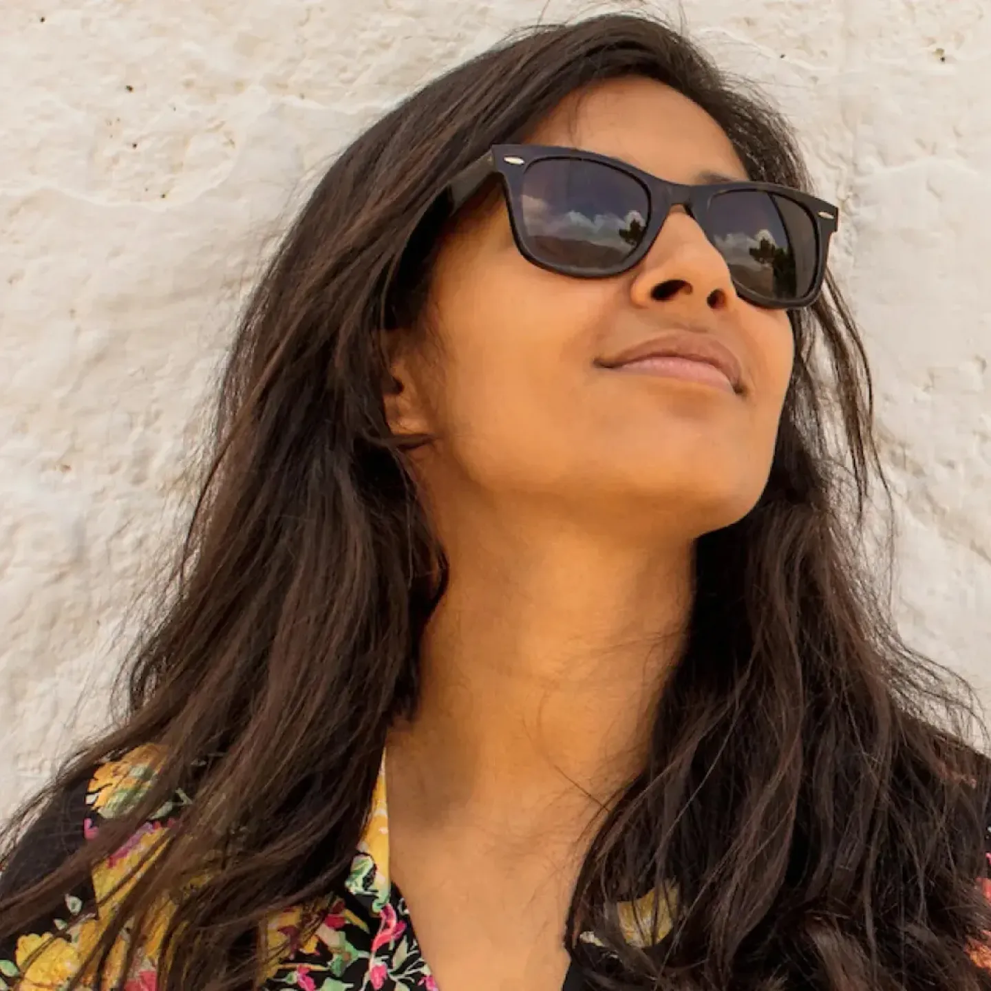 A woman wearing sunglasses.