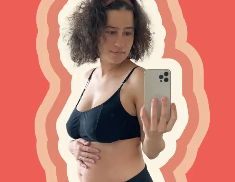 Origin advisor Ilana Glazer taking a selfie as she rubs her postpartum belly.