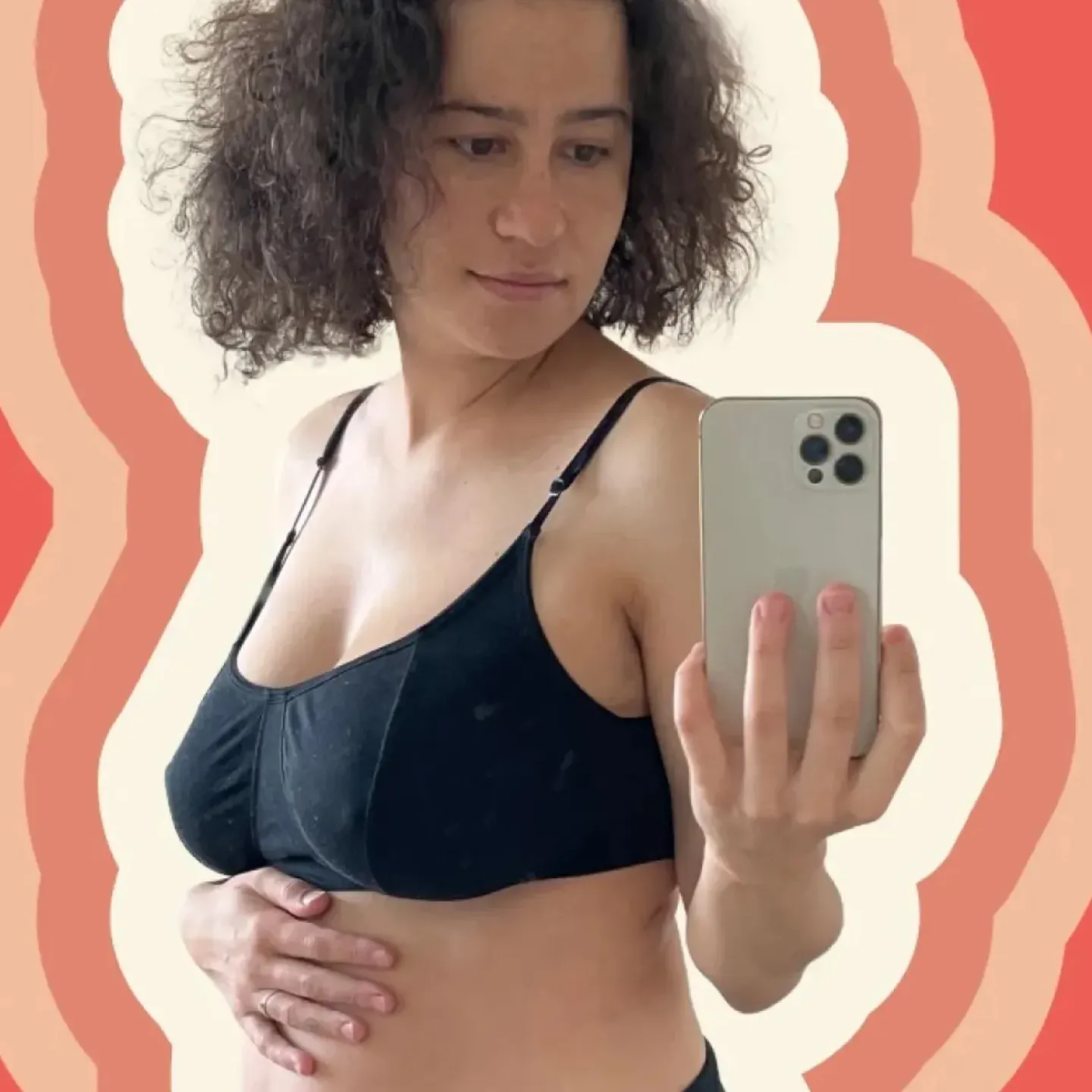 Origin advisor Ilana Glazer taking a selfie as she rubs her postpartum belly.