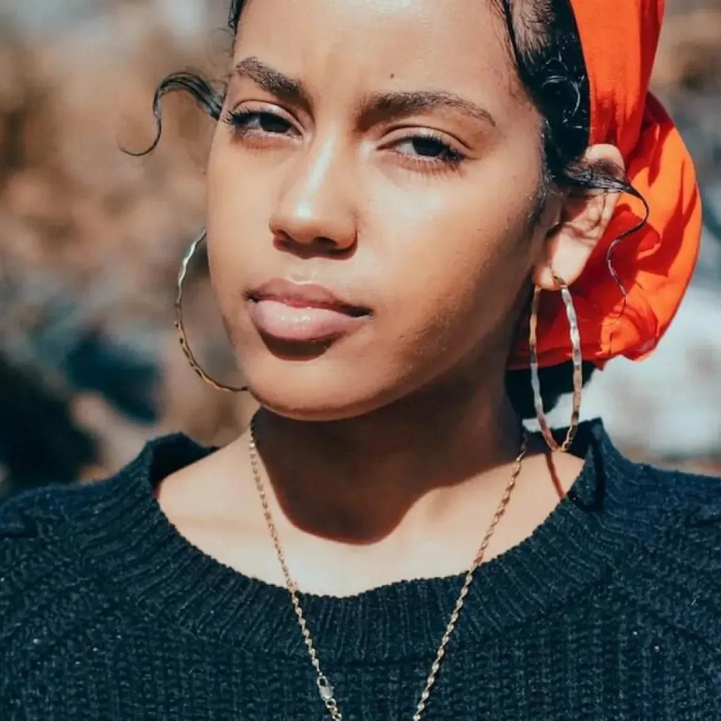 A concerned looking young Black woman.