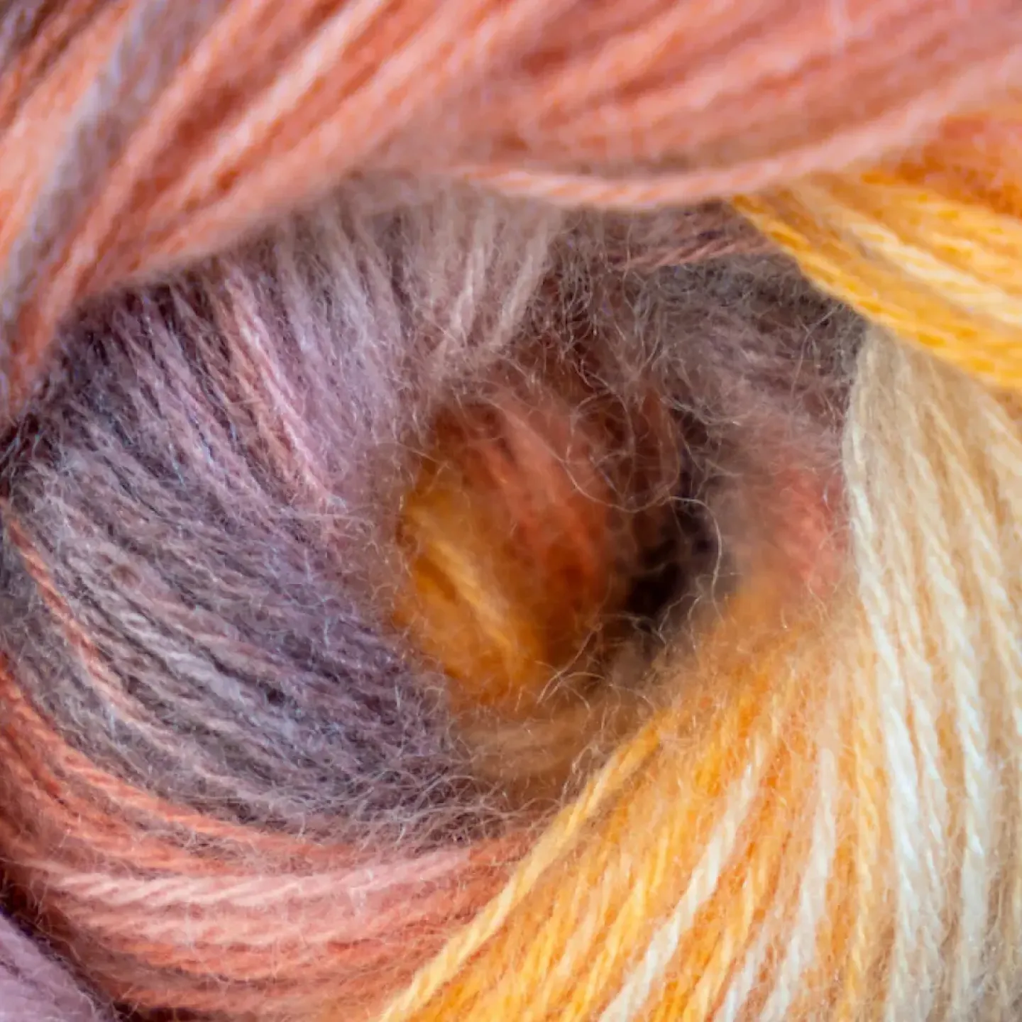 A skein of yarn shown close-up from the side — the whole in the center of the yarn is a metaphor for an anus with rectal prolapse.