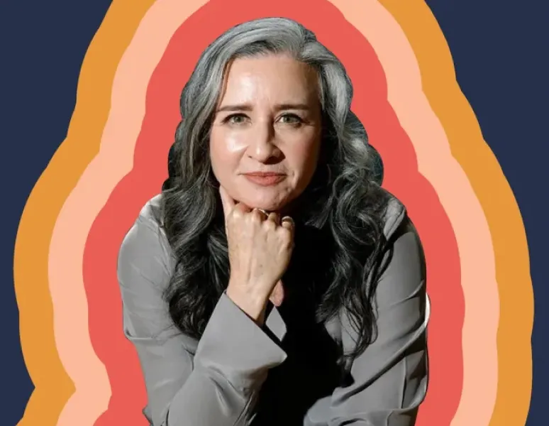 A photo of Dr. Suzanne Gilberg-Lenz, MD, author of Menopause Bootcamp, surrounded by bright colors.
