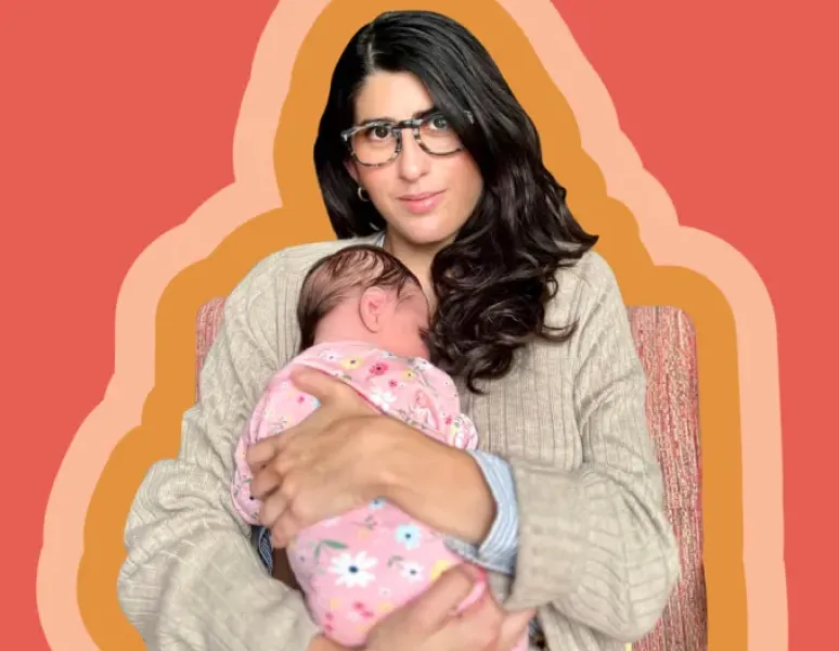 Origin CEO, Co-founder, and writer Carine Carmy confidently holds her newborn baby to her chest.