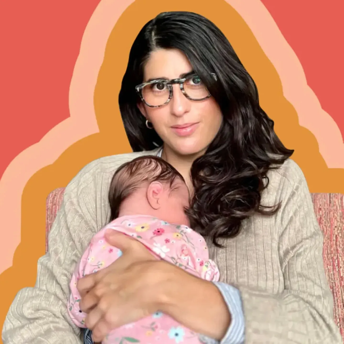 Origin CEO, Co-founder, and writer Carine Carmy confidently holds her newborn baby to her chest.