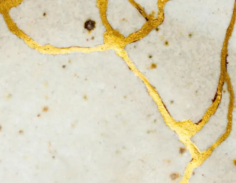 Pottery that has been repaired in the Japanese Kintsugi style to represent an episiotomy scar.