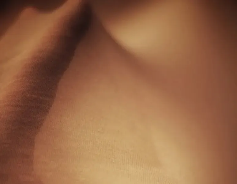 An image of a hand stretching nylon to symbolize the anatomy of fascia.
