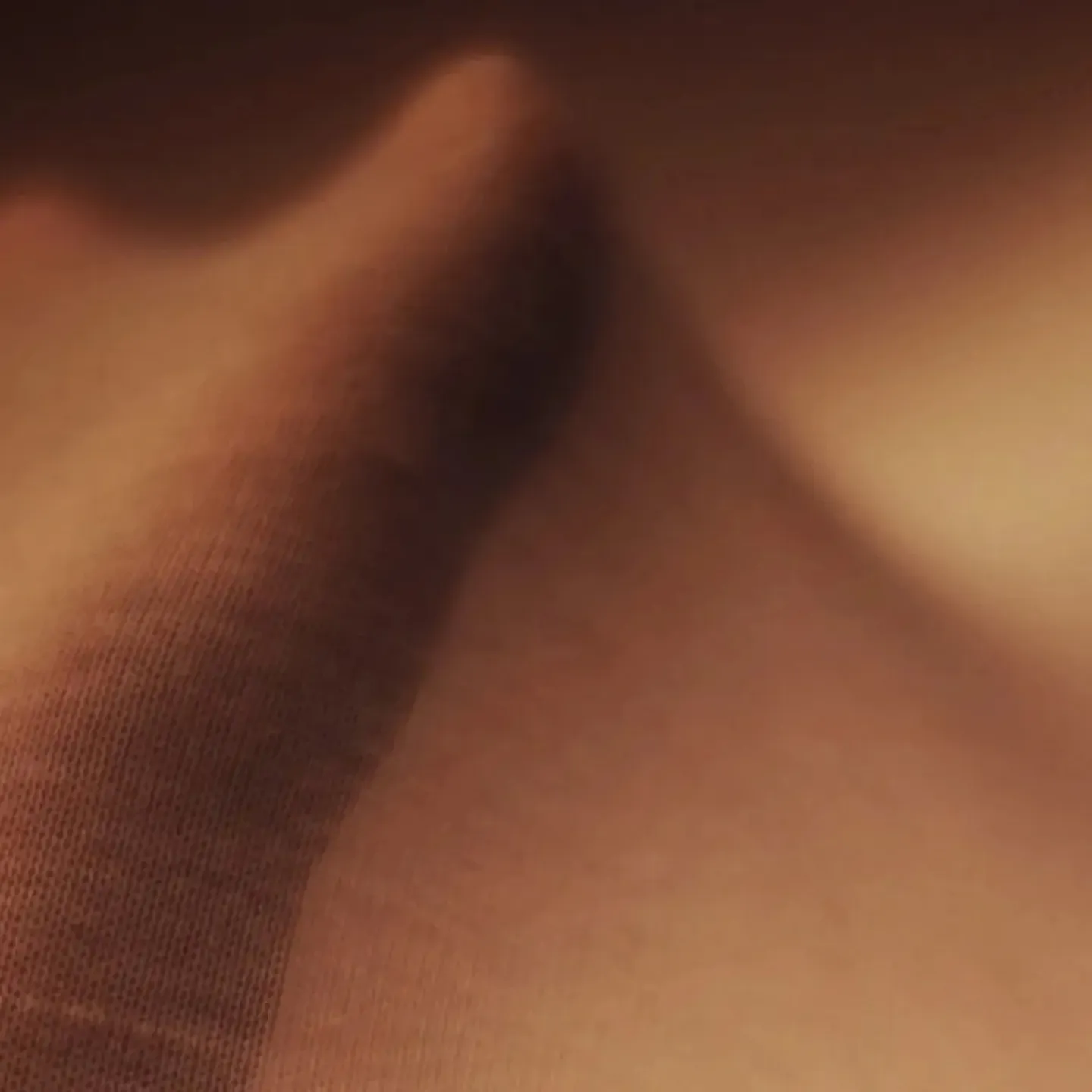 An image of a hand stretching nylon to symbolize the anatomy of fascia.