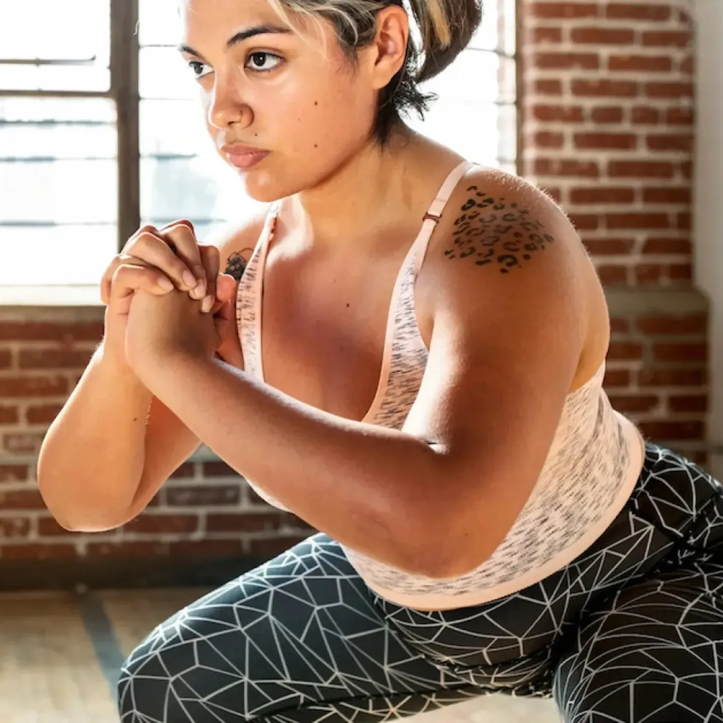 A woman exercising to boost her fertility.