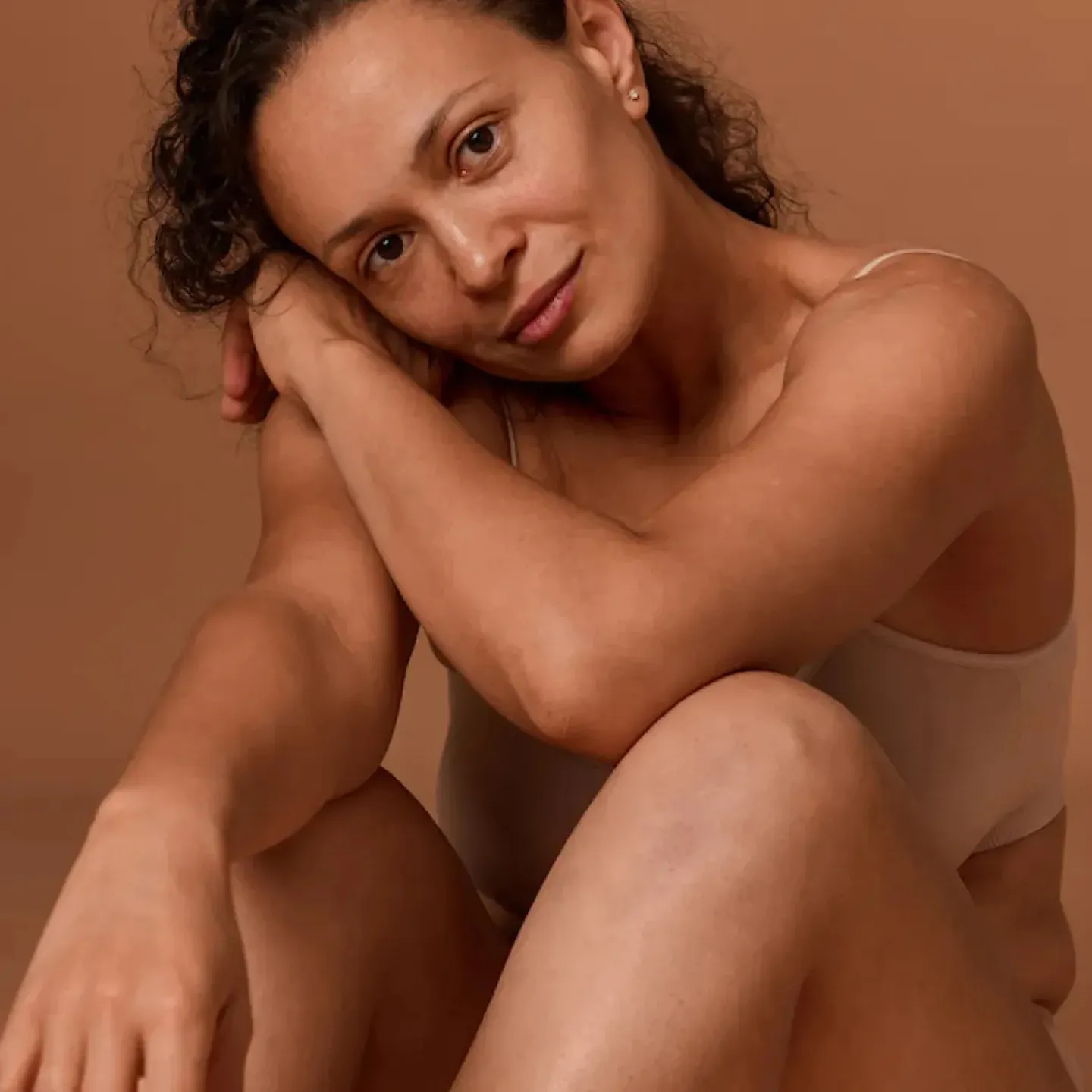 A post-menopausal woman feeling good in her body after receiving pelvic floor physical therapy for pain with sex and weak orgasm.