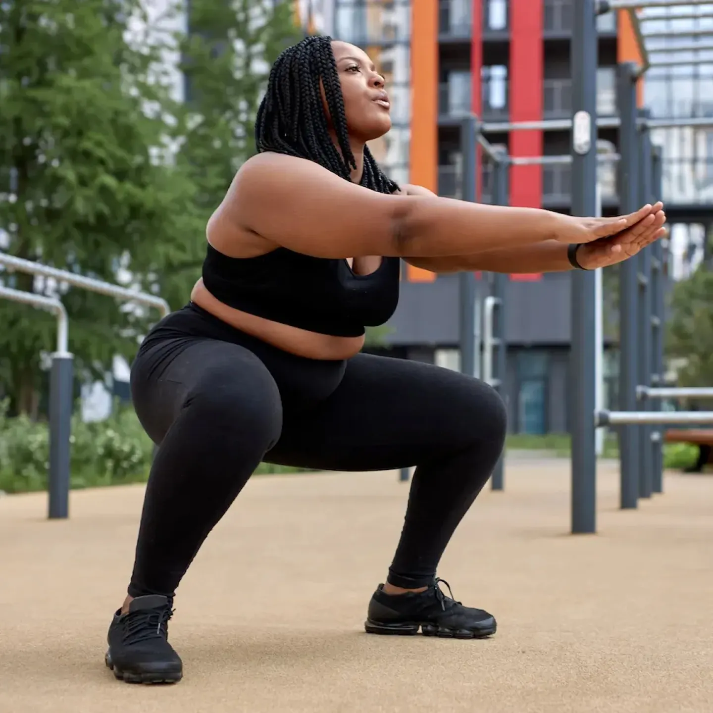 A woman doing pelvic floor exercises for bladder leaks at the park.
