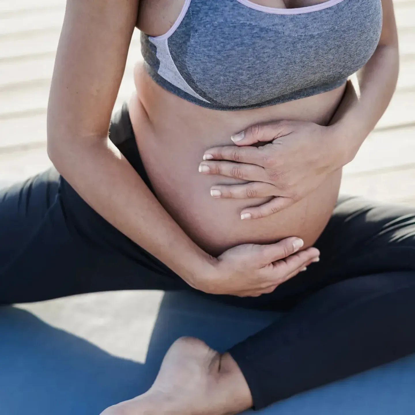 A pregnant woman exercising her pelvic floor.