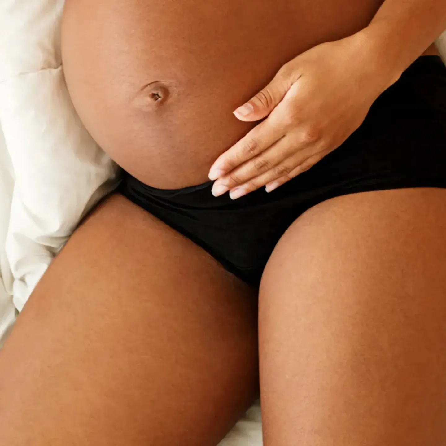 A pregnant woman in her second or third trimester with pregnancy tailbone pain.