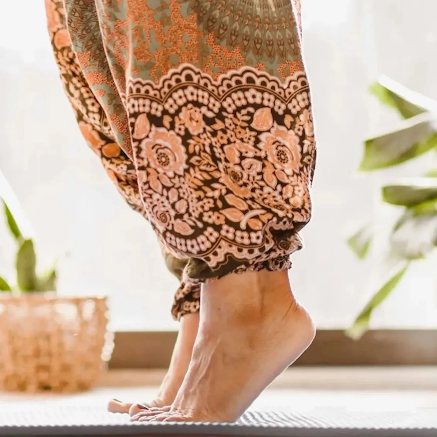 A person with postpartum foot pain stretches out her feet.