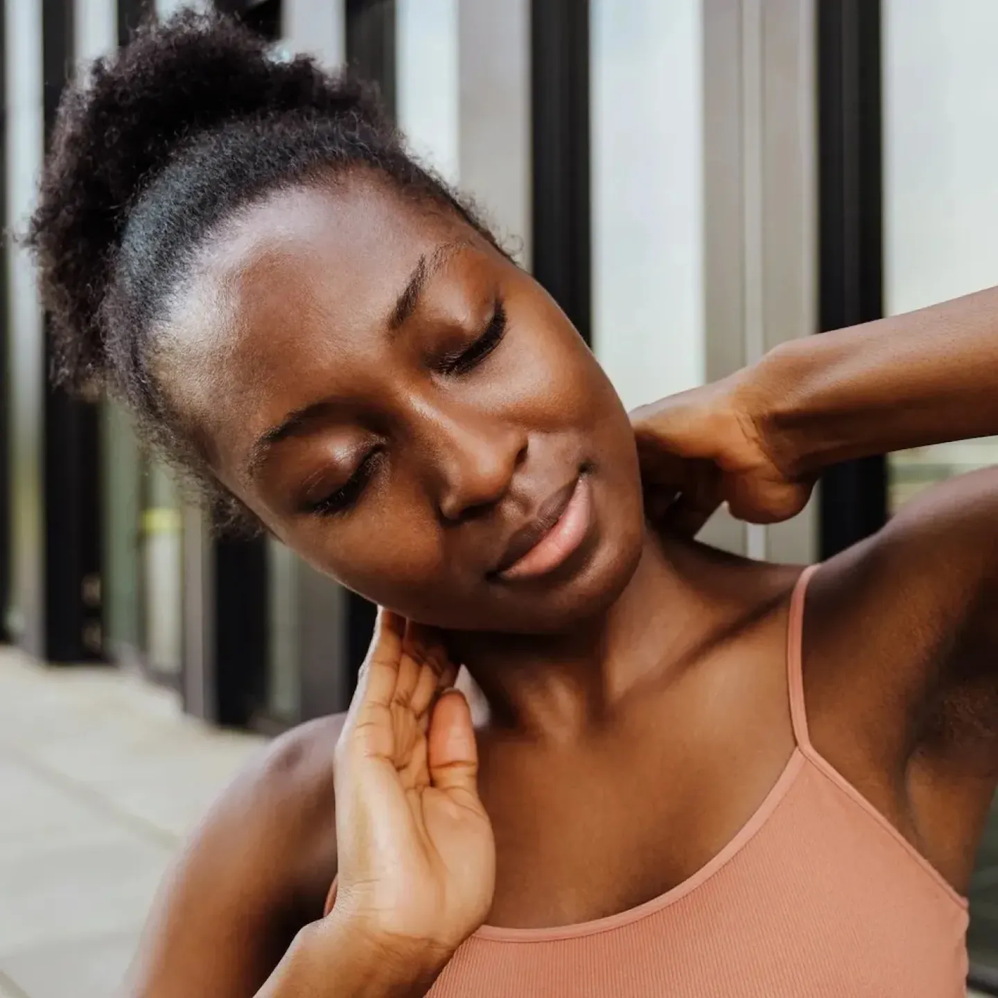 A woman using physical therapy techniques to ease her headache pain.