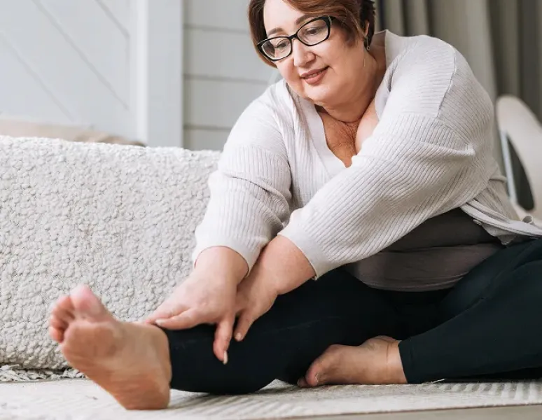 Mature woman doing exercises for her pelvic floor physical therapy appointment.