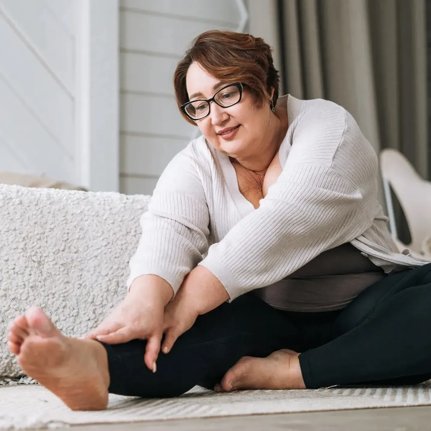 Mature woman doing exercises for her pelvic floor physical therapy appointment.