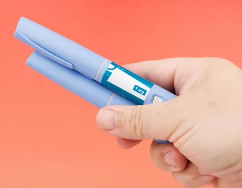 Person holding GLP1s for PMOS/PCOS.