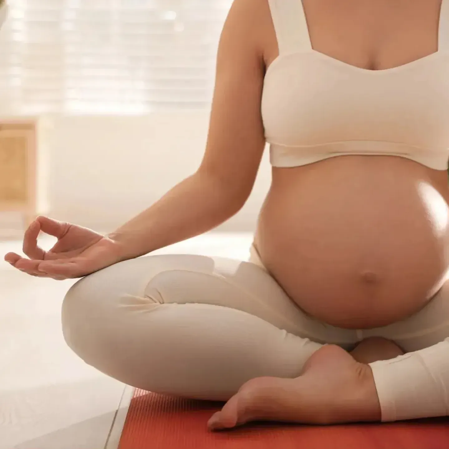 Pregnant woman doing pelvic floor therapy to prepare for labor and birth.