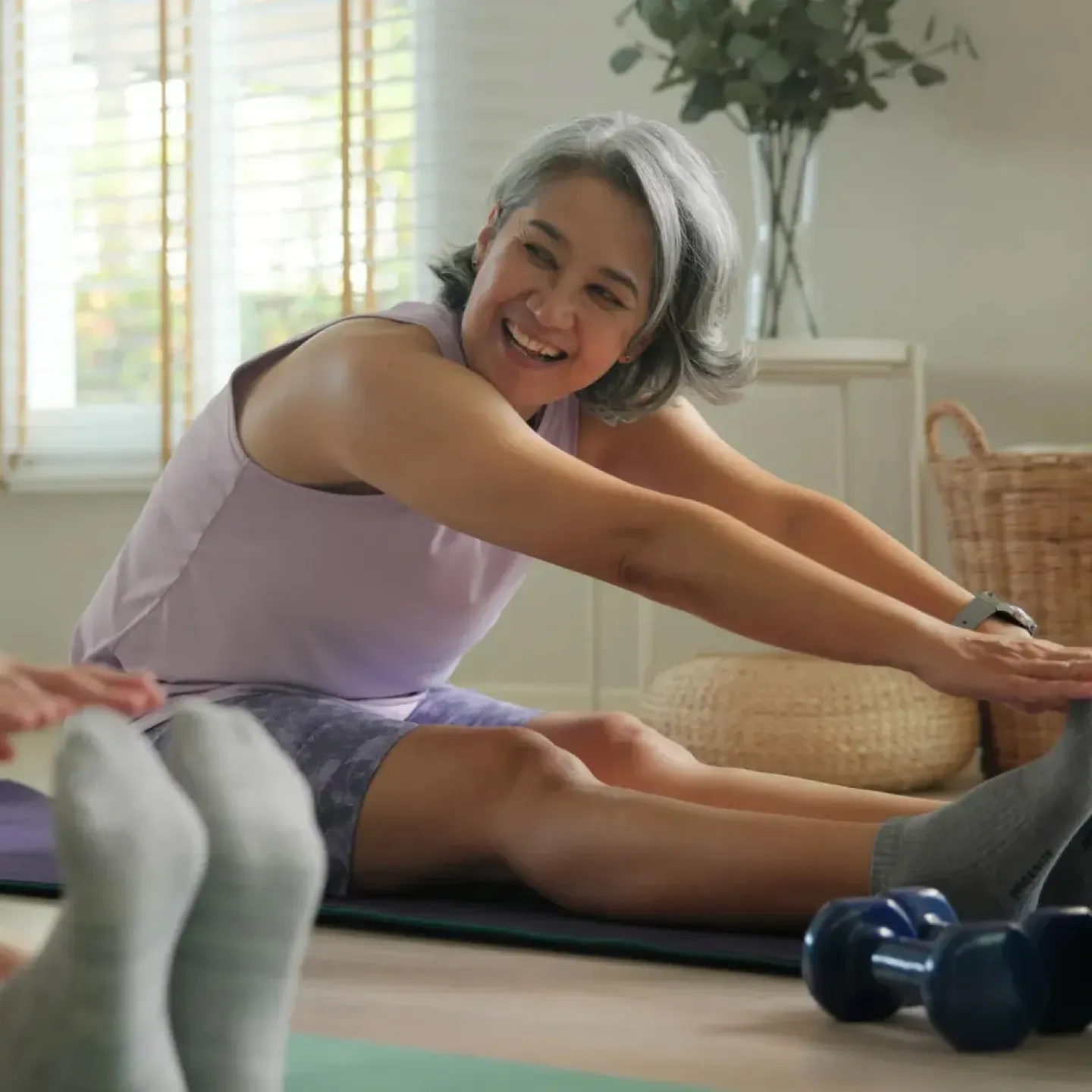 Woman in midlife who is exercising to support her longevity and pelvic and musculoskeletal health.