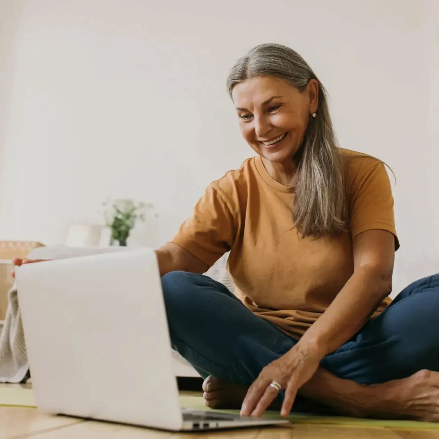 Woman doing a virtual pelvic floor check-up at Origin physical therapy.