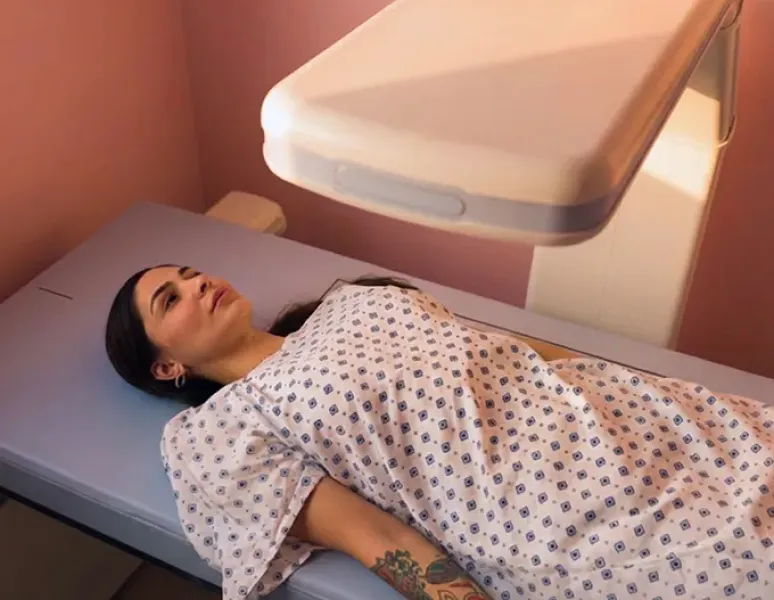 Woman getting a dexa scan.