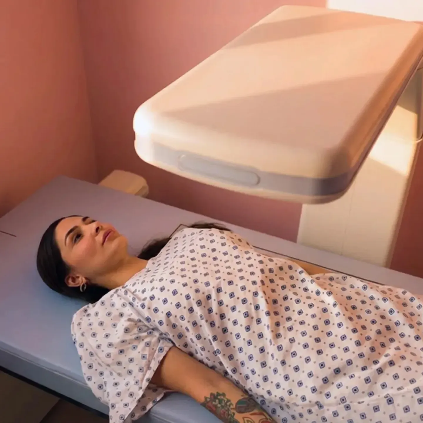 Woman getting a dexa scan.