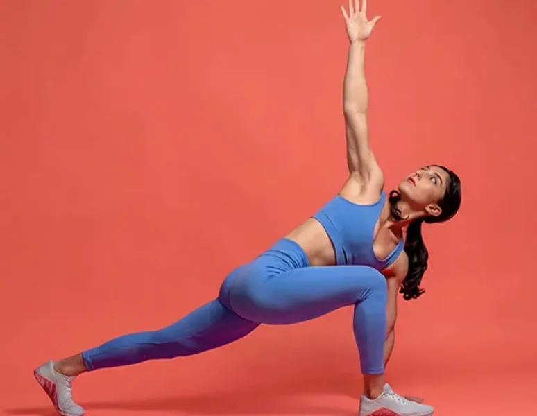Woman doing world's greatest stretch to help her pelvic floor.