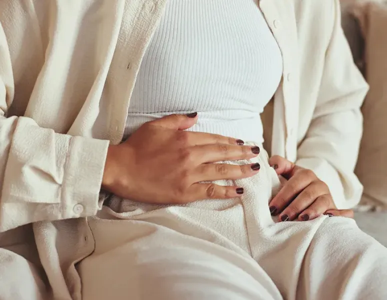 Woman in perimenopause experiencing recurring UTIs.