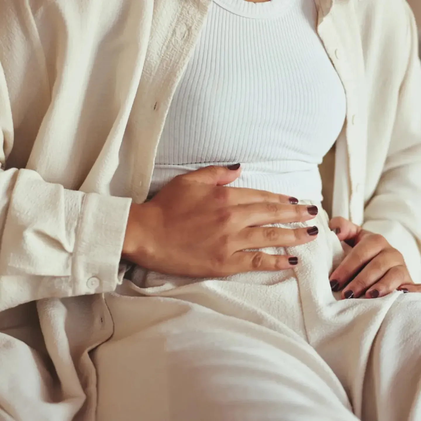 Woman in perimenopause experiencing recurring UTIs.