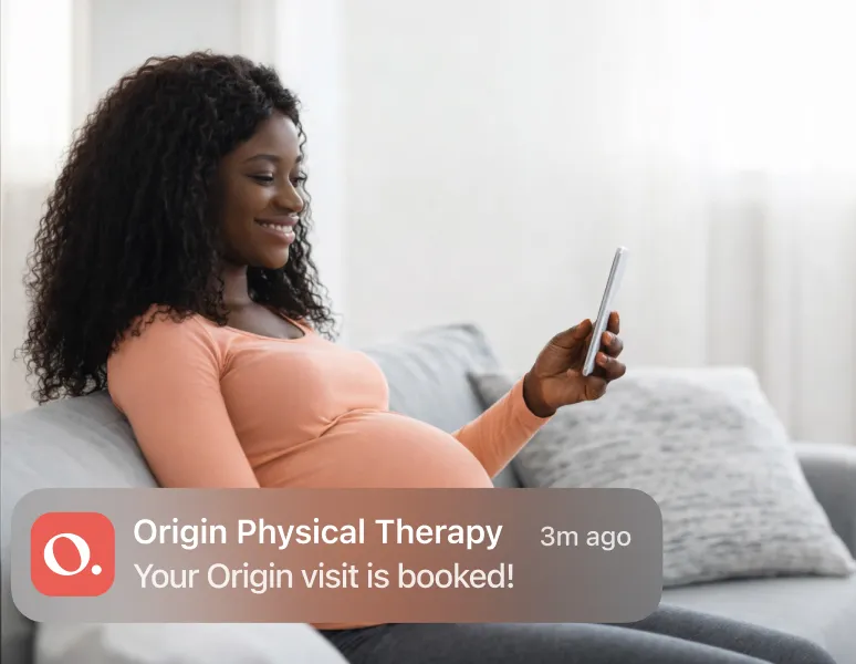 Pregnant woman booking an appointment at Origin on her phone “Your visit is booked!“.